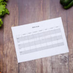 7 Day Diet Plan On Table Full Of Fruits And Vegetables Stock Image